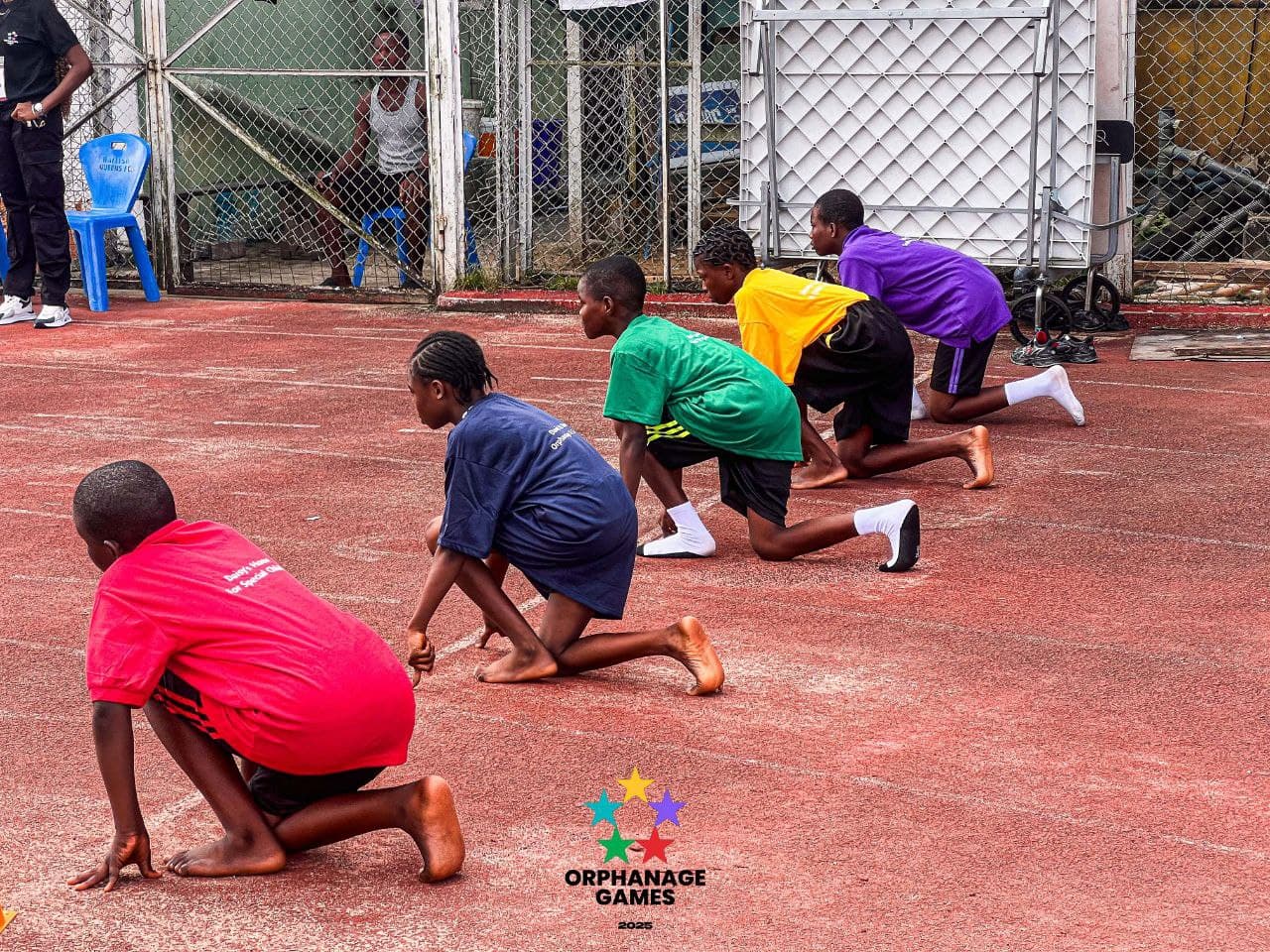 Children at the starting line of a race at the Orphanage Games
